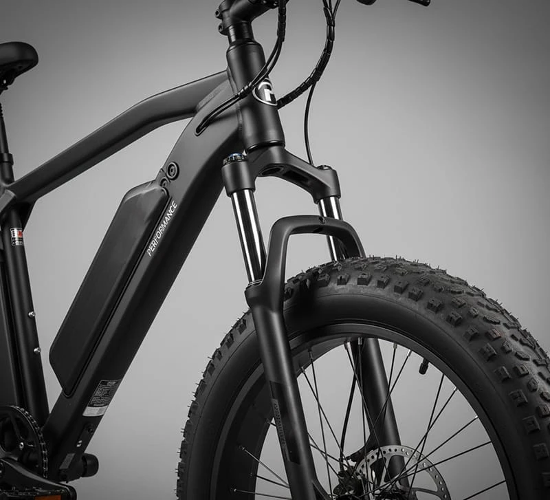 Detail shot of reinforced double shoulder suspension fork on a Poleejiek fat tire ebike, optimized for heavy riders and stability.