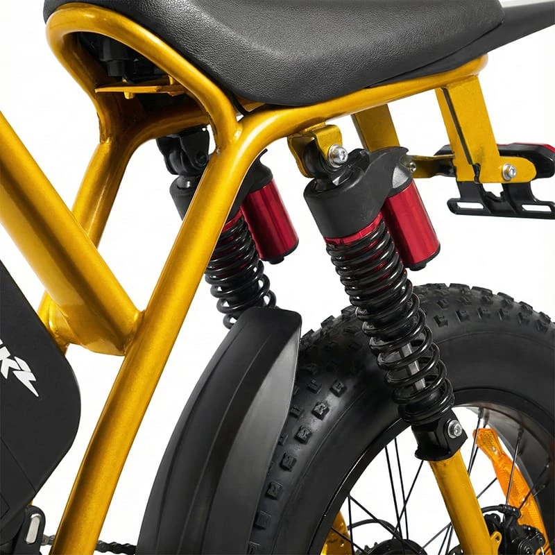 Detail shot of the adjustable hydraulic suspension and 4-inch fat tires on the POLEEJIEK F6 gripping loose dirt and rocky surfaces.