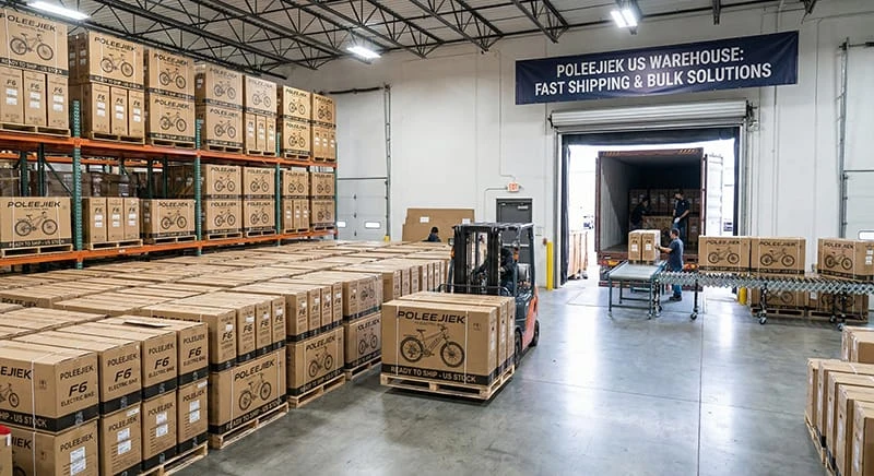 Poleejiek US warehouse interior showing rows of boxed F6 electric bikes ready for fast dropshipping, contrasted with a sea freight container for wholesale bulk orders.